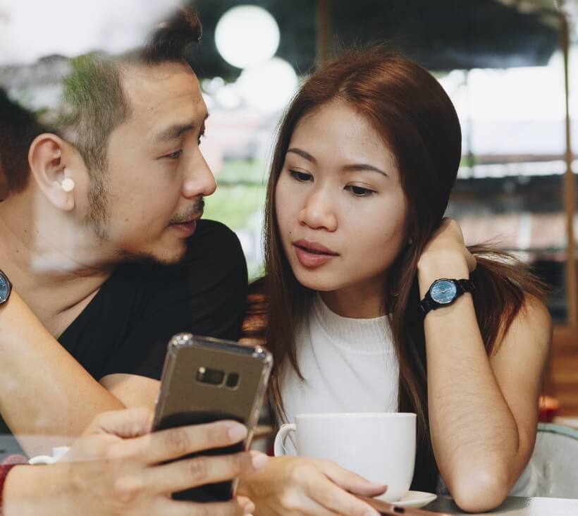 couple looking phone