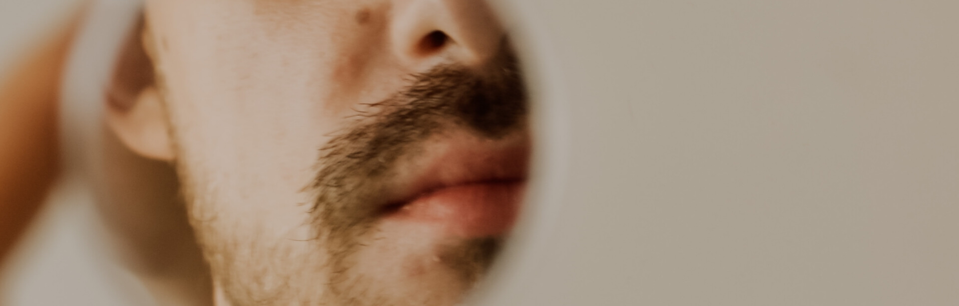 man-looking-in-migrror-2022-11-16-00-47-57-utc-1