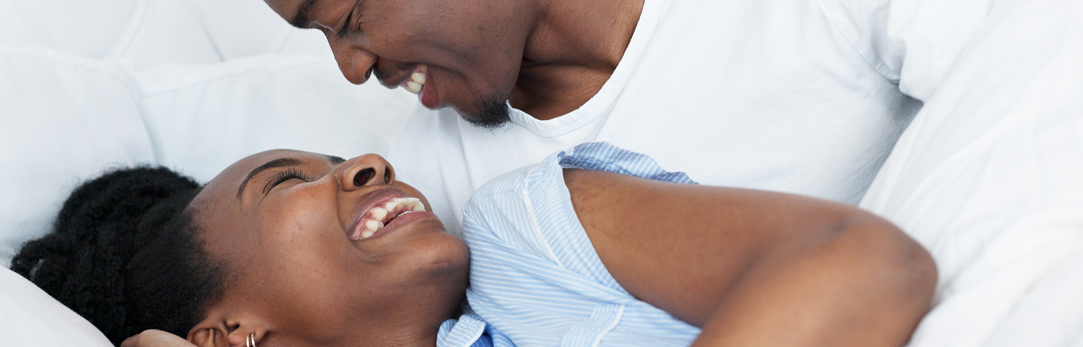 happy-black-couple-in-bedroom-kiss-and-smile-for-l-2023-09-28-15-33-34-utc-copy-1