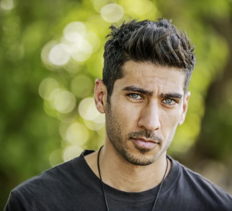portrait-of-sceptical-young-man-in-nature-2022-12-16-22-30-34-utc-1